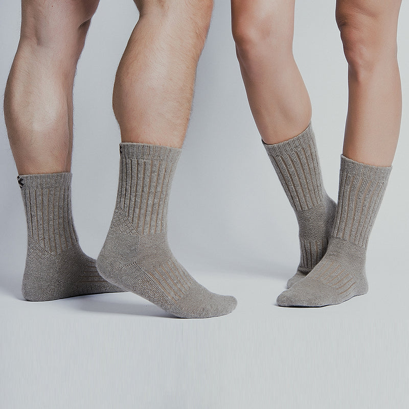 Two people wearing grey Purists yak cashmere socks